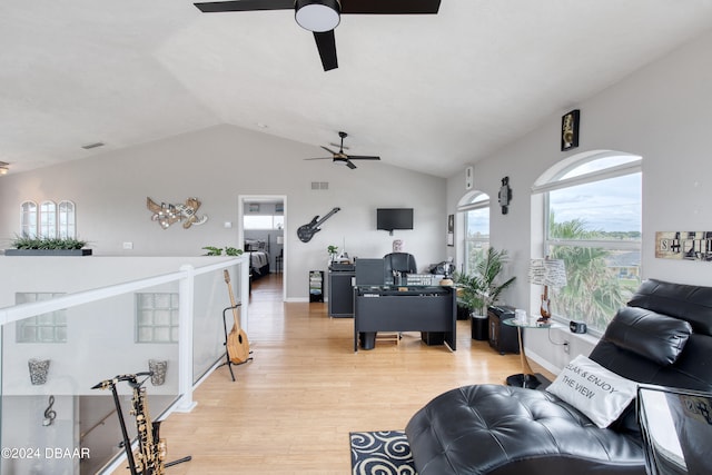 living room featuring lofted ceiling and light wood-type flooring