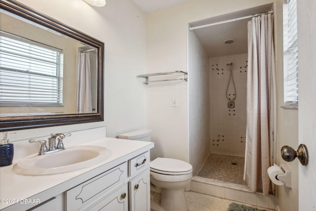 bathroom featuring a shower with shower curtain, tile patterned floors, toilet, and vanity