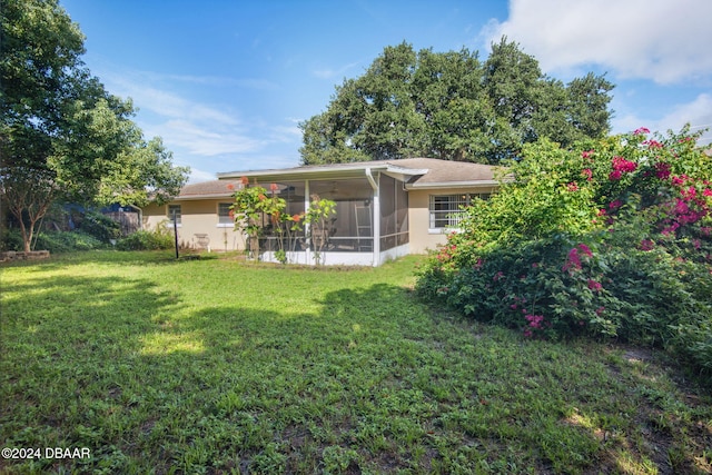 view of yard featuring a sunroom