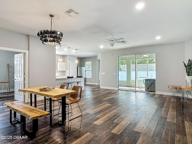 4225 Bristle Cone Way, Port Orange, FL 32129 - dining room featuring recessed lighting, ceiling fan, dark wood-style flooring, and a chandelier