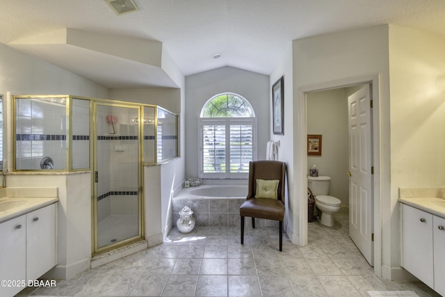 full bathroom featuring visible vents, a shower stall, lofted ceiling, a bath, and vanity