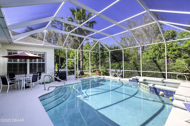 view of swimming pool with a lanai, a grill, a pool with connected hot tub, and a patio