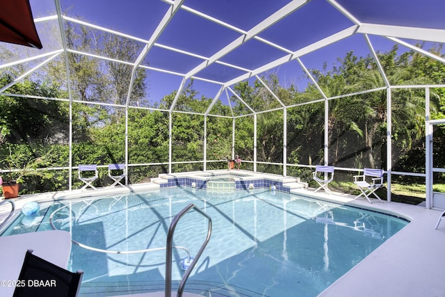 view of swimming pool with a lanai, a patio area, and a pool with connected hot tub