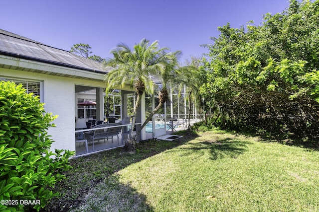 view of yard with an outdoor pool, a lanai, and a patio area