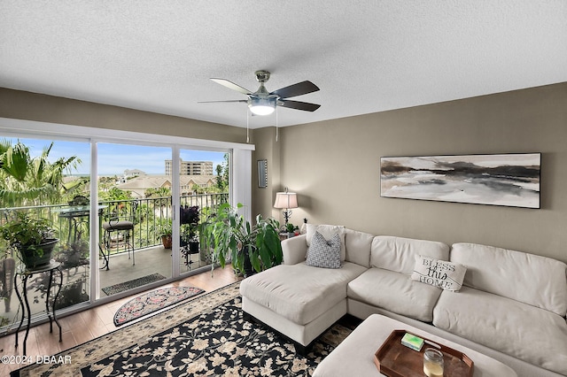 4 Oceans W Blvd Unit 507D, Daytona Beach Shores, FL 32118 - living room with hardwood / wood-style flooring, a textured ceiling, and ceiling fan