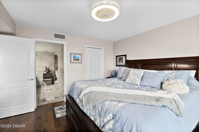 4 Oceans W Blvd Unit 507D, Daytona Beach Shores, FL 32118 - bedroom featuring dark hardwood / wood-style flooring and a closet