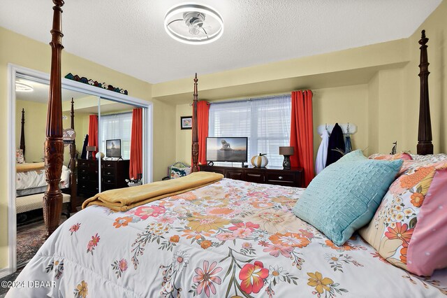 4 Oceans W Blvd Unit 507D, Daytona Beach Shores, FL 32118 - bedroom with a closet and a textured ceiling