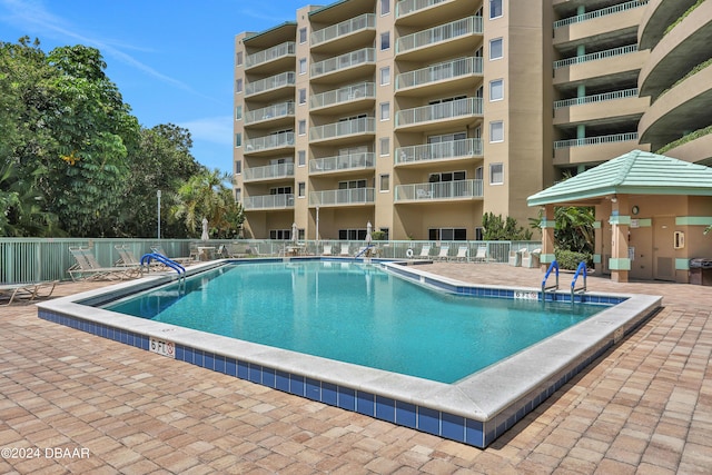 4 Oceans W Blvd Unit 507D, Daytona Beach Shores, FL 32118 - view of swimming pool with a gazebo and a patio area