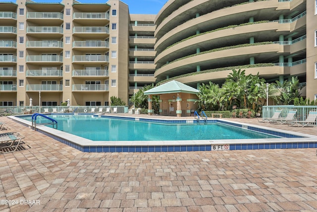 4 Oceans W Blvd Unit 507D, Daytona Beach Shores, FL 32118 - view of pool with a patio