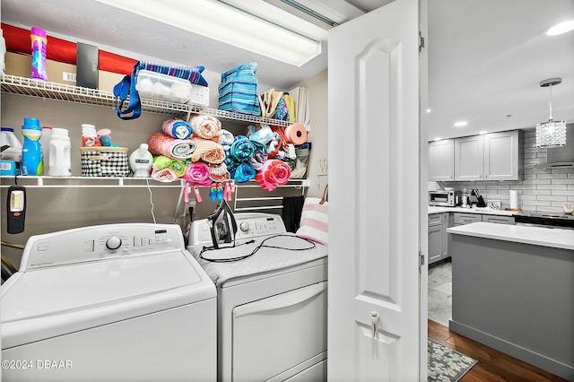 4 Oceans W Blvd Unit 507D, Daytona Beach Shores, FL 32118 - laundry area with dark wood-type flooring and washing machine and dryer