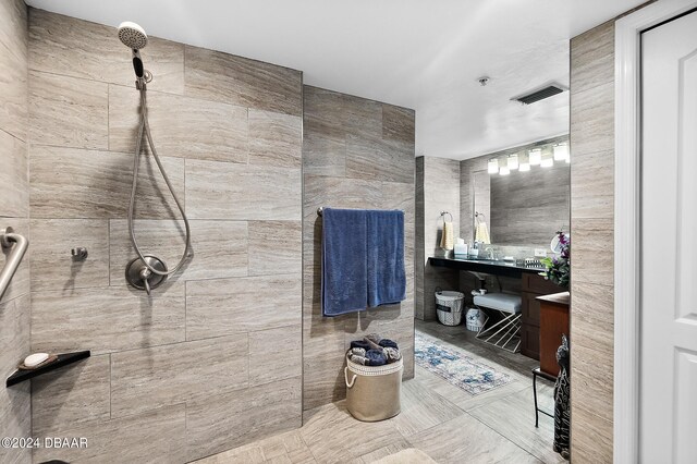 4 Oceans W Blvd Unit 507D, Daytona Beach Shores, FL 32118 - bathroom with tiled shower and tile walls
