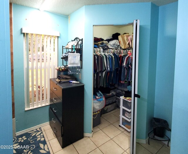 20 Lake Meadow Way, Ormond Beach, FL 32174 - spacious closet featuring light tile patterned flooring