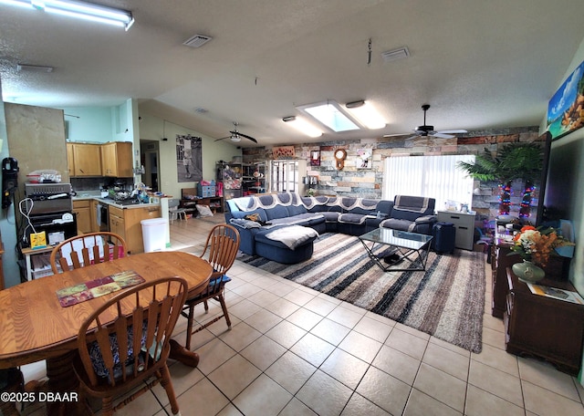 20 Lake Meadow Way, Ormond Beach, FL 32174 - dining area featuring vaulted ceiling, ceiling fan, light tile patterned floors, and a skylight
