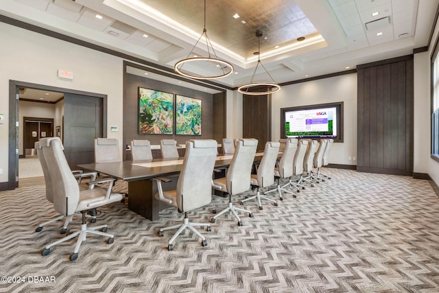 dining area with a tray ceiling and light colored carpet