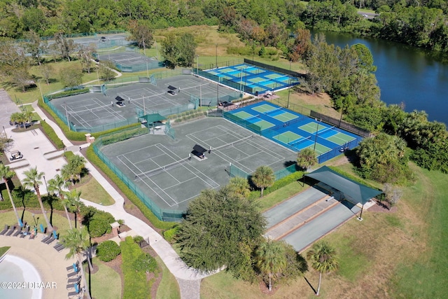 birds eye view of property with a water view