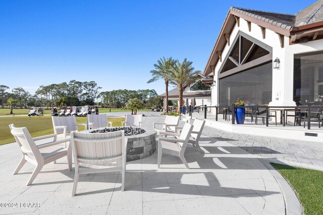 view of patio / terrace featuring an outdoor fire pit