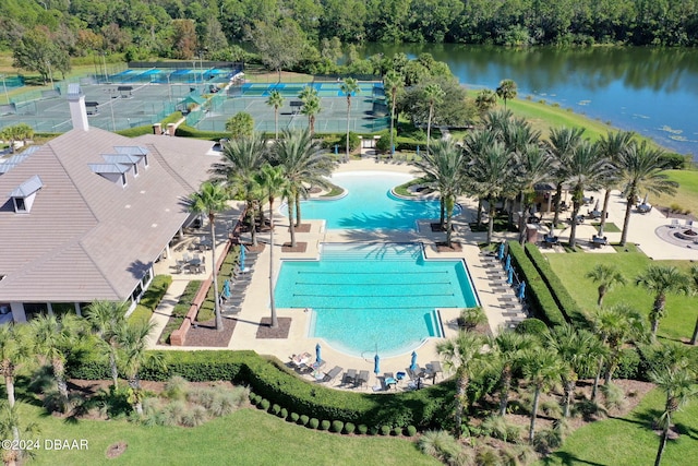 birds eye view of property with a water view