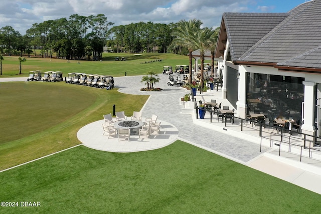 view of yard with a fire pit and a patio area