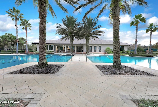 view of swimming pool featuring a patio area