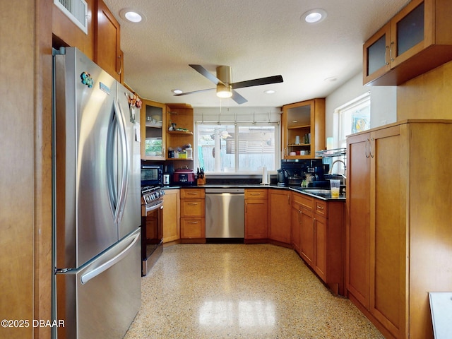 650 S Pine St, New Smyrna Beach, FL 32169 - kitchen featuring ceiling fan, open shelves, appliances with stainless steel finishes, and a wealth of natural light