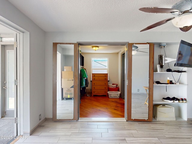 650 S Pine St, New Smyrna Beach, FL 32169 - interior space featuring wood tiled floor and a textured ceiling