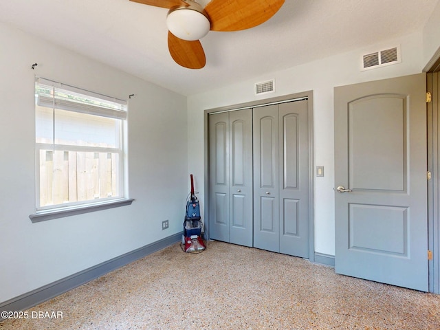 650 S Pine St, New Smyrna Beach, FL 32169 - unfurnished bedroom featuring baseboards, a closet, speckled floor, and visible vents