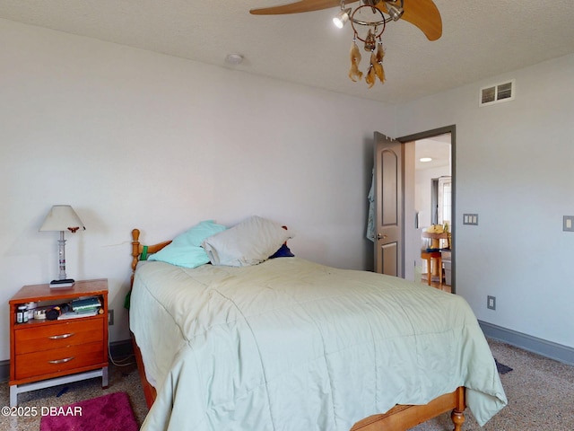 650 S Pine St, New Smyrna Beach, FL 32169 - bedroom with visible vents, carpet flooring, and a ceiling fan