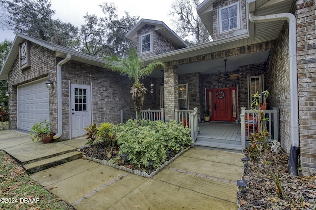 property entrance with a porch and a garage