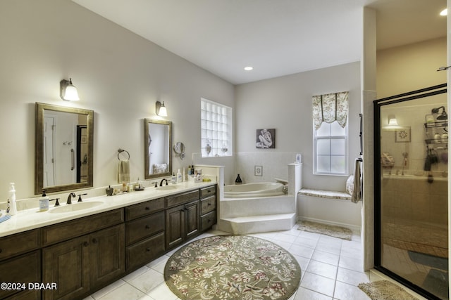 bathroom featuring tile patterned floors, vanity, and a healthy amount of sunlight