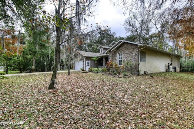 view of side of property featuring a garage