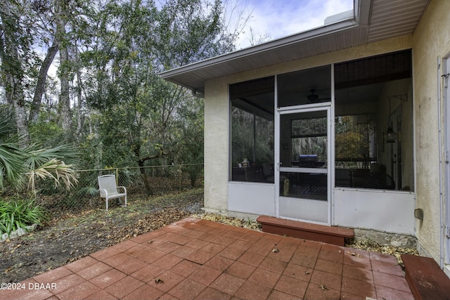 view of patio with a sunroom