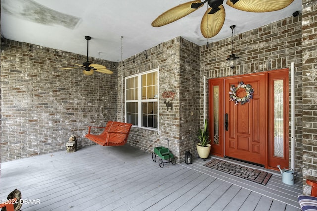 view of exterior entry with covered porch