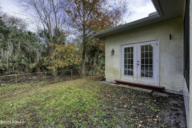 view of yard with french doors