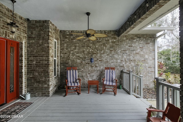 wooden terrace featuring ceiling fan and french doors