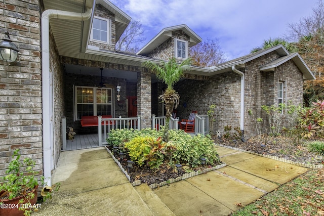 property entrance with covered porch