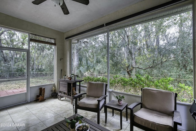 sunroom featuring ceiling fan