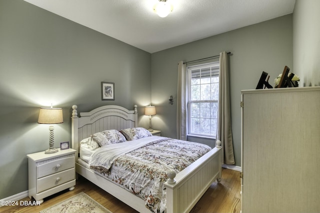 bedroom featuring wood-type flooring