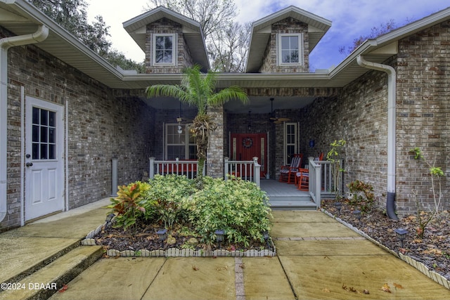 view of exterior entry with covered porch