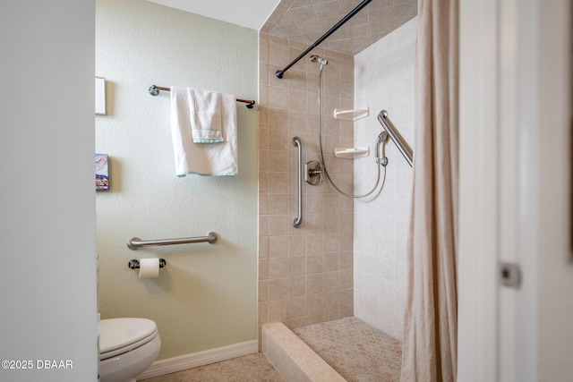 bathroom featuring toilet and a shower with curtain