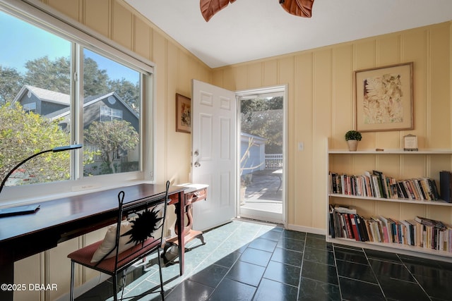 doorway with dark tile patterned floors