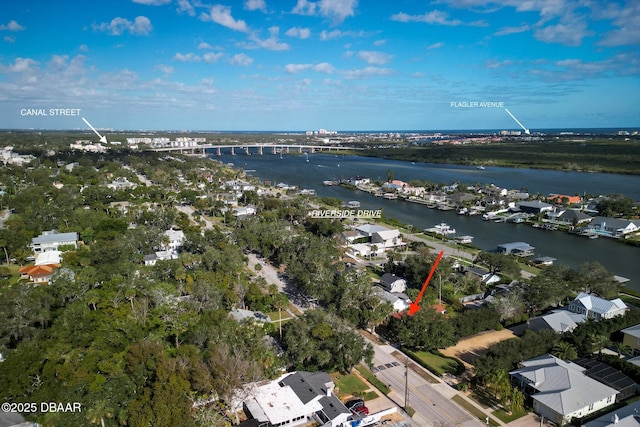 birds eye view of property with a water view