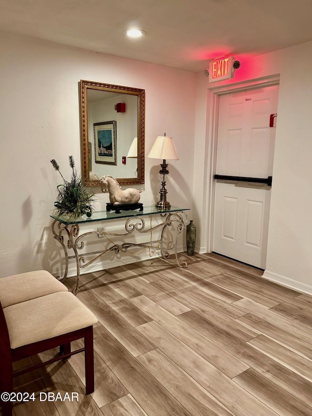 corridor featuring hardwood / wood-style floors