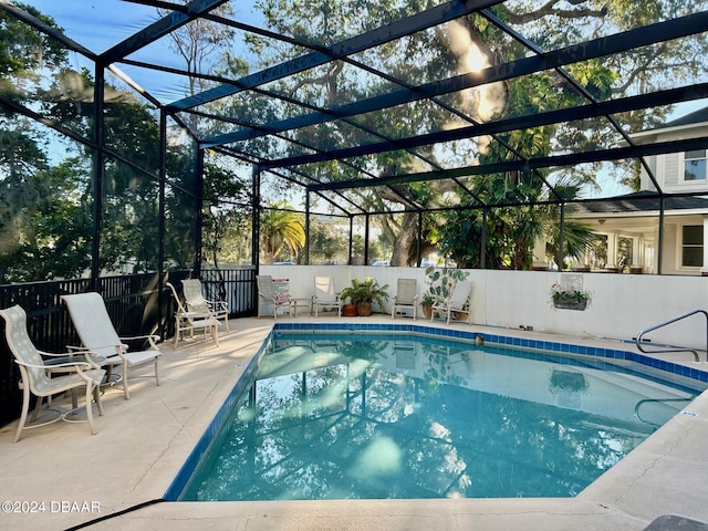 view of pool featuring a lanai and a patio area