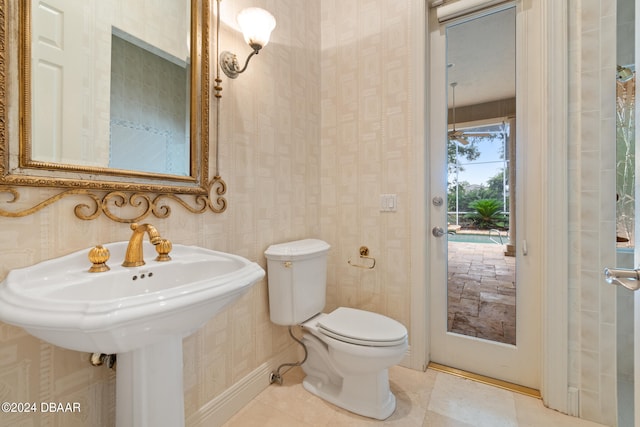 bathroom featuring tile patterned flooring and toilet