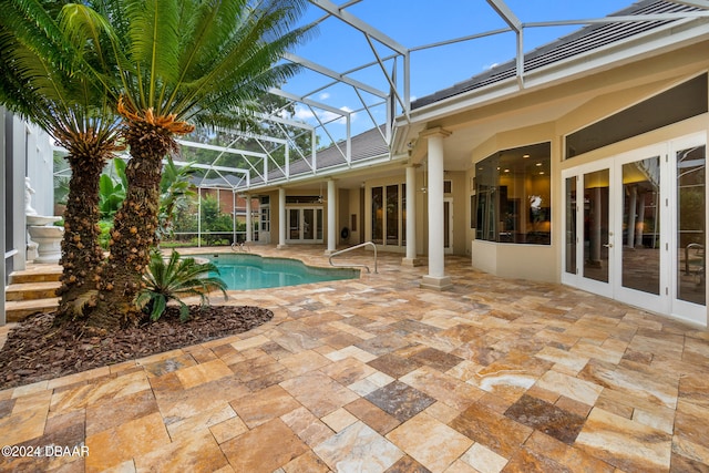 view of pool featuring a patio, french doors, and a lanai