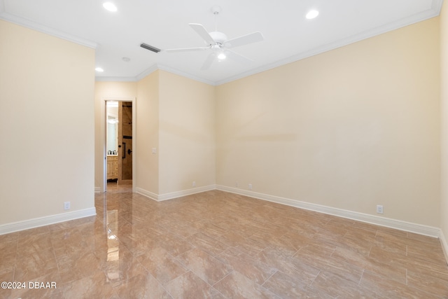 spare room with ceiling fan and crown molding