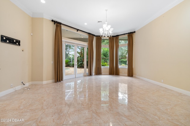 empty room with plenty of natural light, a chandelier, and crown molding