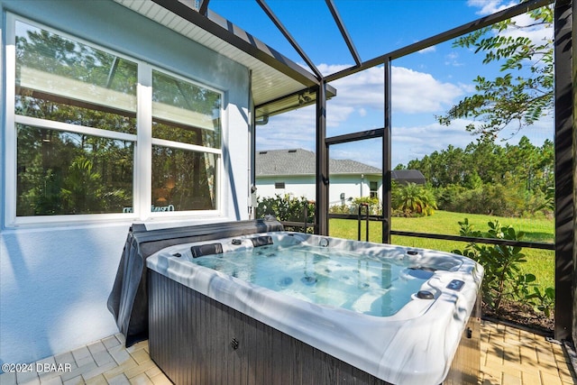 sunroom with a hot tub