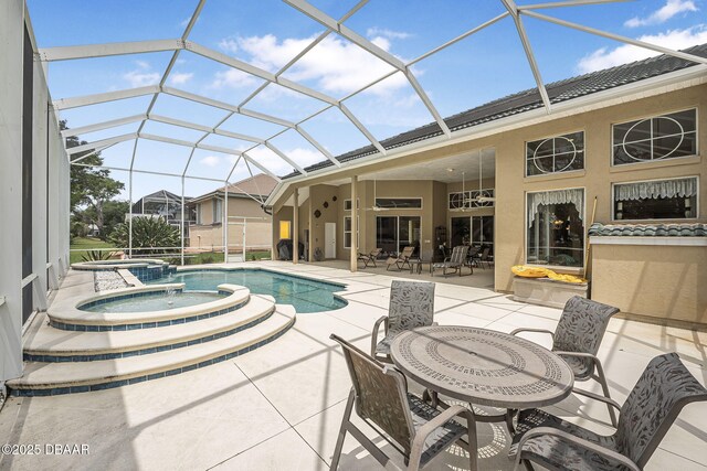 1766 Roscoe Turner Trl, Port Orange, FL 32128 - view of swimming pool featuring a patio area, a pool with connected hot tub, outdoor dining area, and a lanai