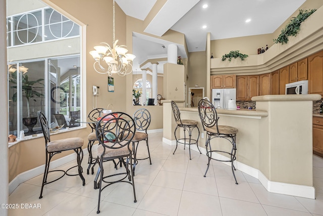 1766 Roscoe Turner Trl, Port Orange, FL 32128 - dining space featuring plenty of natural light, baseboards, light tile patterned floors, a chandelier, and recessed lighting